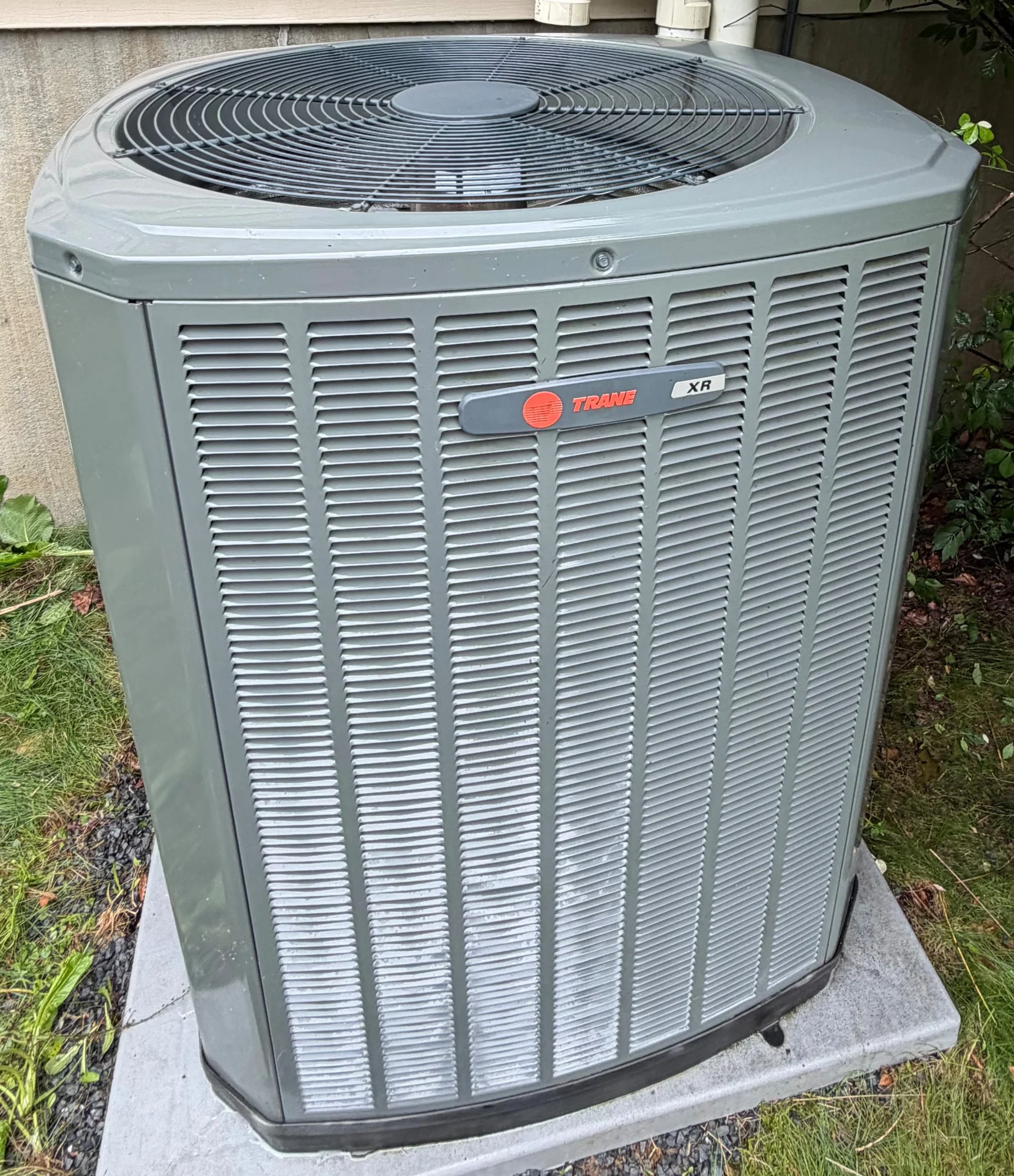 Trane XR heat pump installed on a concrete pad