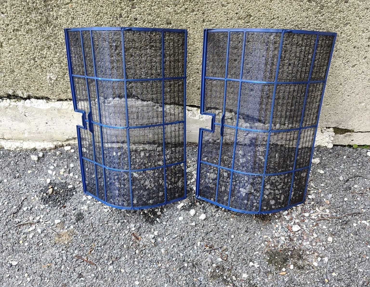 Dirty mini-split air filters removed for cleaning